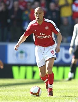 Images Dated 11th April 2009: Mikael Silvestre's Dominance: Arsenal Crushes Wigan Athletic 4-1 in Premier League