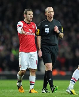 Manchester City Collection: Mike Dean and Jack Wilshere: A Moment of Discussion during Arsenal vs Manchester City (2012-13)