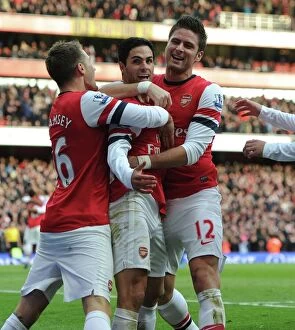 Mikel Arteta, Aaron Ramsey, and Olivier Giroud Celebrate Goal for Arsenal against Queens Park Rangers (2012-13)