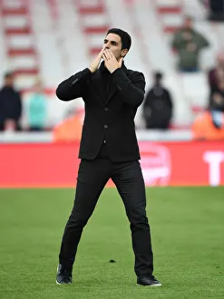 Mikel Arteta Celebrates with Arsenal Fans: Arsenal's Victory over Brighton & Hove Albion at Emirates Stadium (2021)