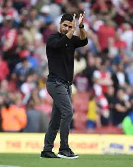 Mikel Arteta Celebrates with Arsenal Fans: Arsenal's Triumph over Norwich City