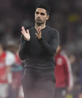 Mikel Arteta Celebrates with Arsenal Fans: Triumph over Tottenham in 2021-22 Season