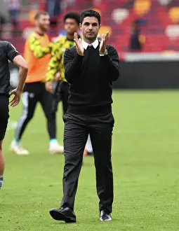 Mikel Arteta Celebrates with Arsenal Fans: Victory at Brentford in 2022-23 Premier League