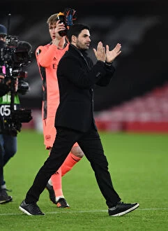 Arsenal v SK Rapid Wien 2020-21 Collection: Mikel Arteta Celebrates Europa League Victory with Arsenal Fans at Emirates Stadium