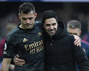 Images Dated 12th March 2023: Mikel Arteta Consoles Granit Xhaka: Emotional Moment After Arsenal's Win Against Fulham