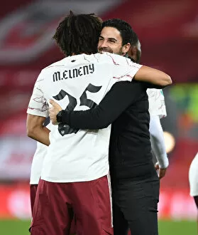 Liverpool v Arsenal - Carabao Cup 2020-21 Collection: Mikel Arteta Embraces Mo Elneny: Liverpool vs Arsenal in Empty Anfield - Carabao Cup 2020-21