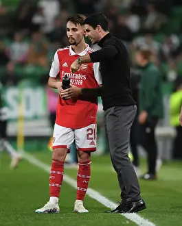 Sporting Lisbon V Arsenal 2022-23 Prints: Mikel Arteta Engages with Fabio Vieira: Tactical Discussion between Sporting CP and Arsenal FC in Europa League Clash