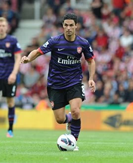 Images Dated 26th August 2012: Mikel Arteta Leads Arsenal Against Stoke City in Premier League Clash (2012-13)