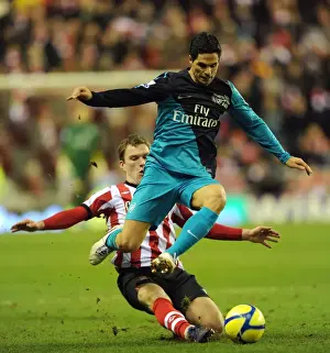 Sunderland V Arsenal - FA Cup 2011-12 Prints: Mikel Arteta Leaps Past Craig Gardner: Sunderland vs. Arsenal, FA Cup 2011-12