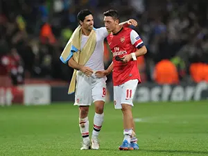 Arsenal V Napoli 2013-14 Prints: Mikel Arteta and Mesut Ozil: Arsenal's Midfield Duo in Action against Napoli (2013-14)