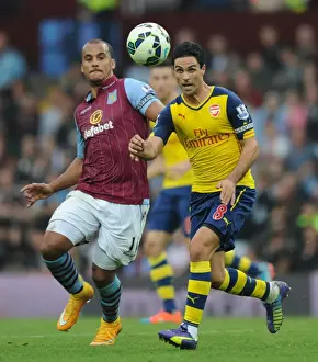 Aston Villa V Arsenal 2014-15 Prints: Mikel Arteta vs. Gabby Agbonlahor: Intense Battle in Aston Villa vs