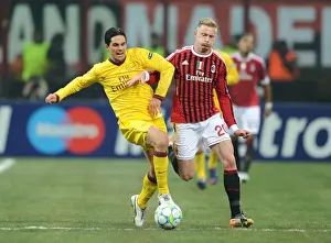 AC Milan V Arsenal 2011-12 Prints: Mikel Arteta vs Ignazio Abate: Intense Clash in AC Milan vs Arsenal UEFA Champions League Match