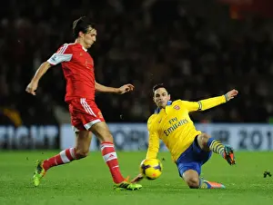 Southampton V Arsenal 2013-14 Prints: Mikel Arteta vs Jack Cork: Intense Battle in Southampton vs Arsenal Premier League Clash