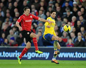 Cardiff City V Arsenal 2013-14 Prints: Mikel Arteta vs Jordan Mutch: Intense Clash in Cardiff City vs Arsenal