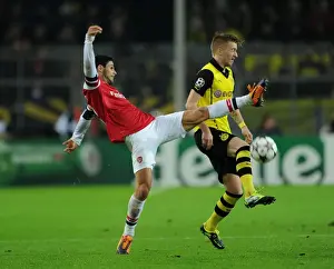Borussia Dortmund V Arsenal 2013-14 Prints: Mikel Arteta vs. Marco Reus: Intense Clash in Borussia Dortmund vs