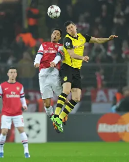 Mikel Arteta vs. Robert Lewandowski: A Battle in the 2013-14 Borussia Dortmund vs. Arsenal UEFA Champions League Match
