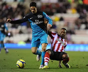 Sunderland V Arsenal - FA Cup 2011-12 Prints: Mikel Arteta vs. Stephane Sessegnon: A FA Cup Showdown at Sunderland's Stadium of Light