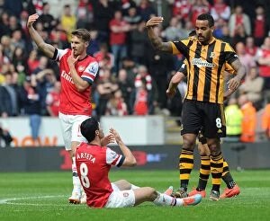 Hull City v Arsenal 2013/14 Collection: Mikel Arteta's Tooth-Shattering Moment: Hull City vs. Arsenal, 2013/14