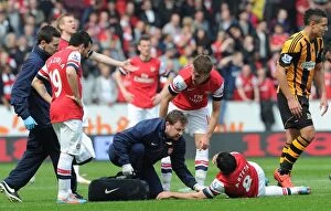 Images Dated 20th April 2014: Mikel Arteta's Tooth-Shattering Moment: Aaron Ramsey and Colin Lewin's Reaction
