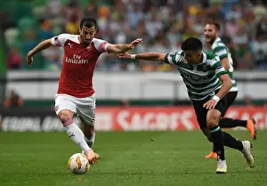 Sporting Lisbon V Arsenal 2018-19 Prints: Mkhitaryan vs Acuna: A Europa League Battle at the Estadio Jose Alvalade