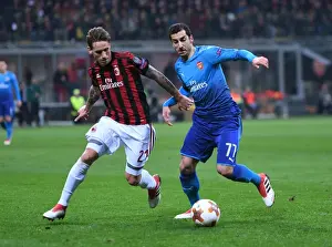 AC Milan V Arsenal 2017-18 Prints: Mkhitaryan vs Biglia: Battle in the Europa League - Arsenal vs AC Milan