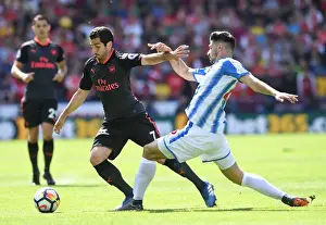 Huddersfield Town V Arsenal 2017-18 Prints: Mkhitaryan vs Schindler: Intense Battle in Huddersfield Town vs Arsenal Premier League Clash