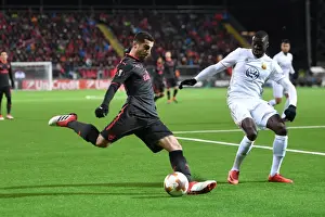 Ostersunds V Arsenal 2017-18 Prints: Mkhitaryan vs Sema: Intense Battle in Ostersund's Europa League Clash Against Arsenal