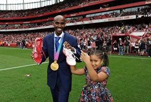Arsenal v Swansea City 2011-12 Collection: Mo Farah, Arsenal Supporter and 5000m World Champion, Celebrates Victory at Emirates Stadium as