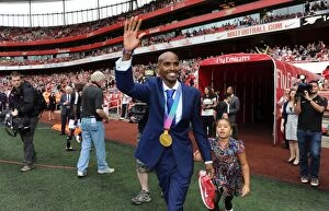 Arsenal v Swansea City 2011-12 Collection: Mo Farah's Victory Wave: Arsenal Leads Swansea City 1-0 in Premier League