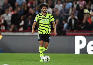 Images Dated 28th September 2023: Mohamed Elneny in Action: Arsenal's Midfield Maestro Shines in Carabao Cup Clash Against Brentford