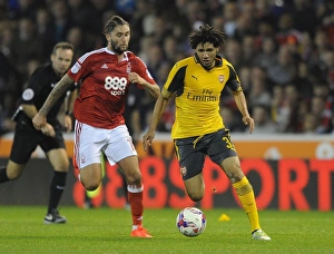 Nottingham Forest V Arsenal EPL Cup 3rd Round 2016-17 Prints: Mohamed Elneny vs. Henri Lansbury: A Battle in the EFL Cup Third Round between Nottingham Forest and Arsenal