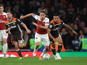 Arsenal V Brentford - Carabao Cup 2018-19 Prints: Monreal Overpowers Yennaris: Arsenal vs. Brentford in Carabao Cup