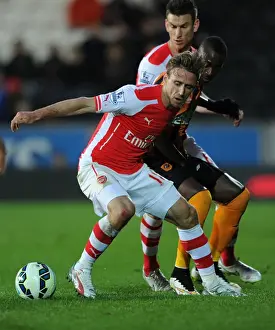 Hull City V Arsenal 2014/15 Prints: Monreal vs. Aluko: A Premier League Showdown at Hull City (2014/15)