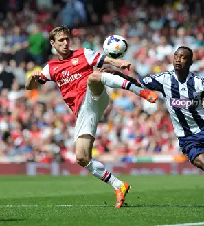 Arsenal V West Bromwich Albion 2013-14 Prints: Monreal vs. Berahino: Intense Battle at Emirates Stadium (Arsenal v West Bromwich Albion)