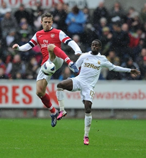 Swansea Prints: Monreal vs. Dyer: Intense Battle in Swansea City vs. Arsenal Premier League Clash