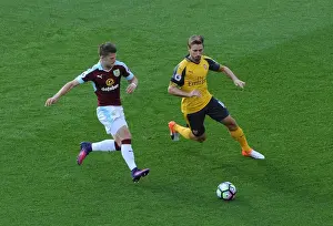 Burnley V Arsenal 2016-17 Prints: Monreal vs. Gudmundsson: A Footballing Battle at Turf Moor (2016-17)