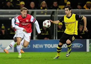 Borussia Dortmund V Arsenal 2013-14 Prints: Monreal vs Mkhitaryan: A Champions League Showdown at Borussia Dortmund's Signal Iduna Park