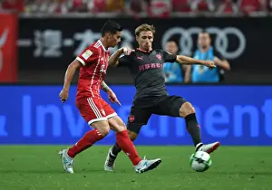 Bayern Munich V Arsenal 2017-18 Prints: Monreal vs Rodriguez: A Football Rivalry Erupts - Arsenal vs Bayern Munich