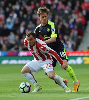 Stoke City V Arsenal 2016-17 Prints: Monreal vs Shaqiri: Intense Battle in Stoke City vs Arsenal Premier League Clash