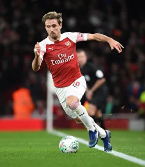 Arsenal V Tottenham Hotspur Carabao Cup 2018-19 Prints: Monreal's Intense Focus: Arsenal vs. Tottenham in Carabao Cup Quarterfinals