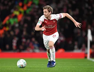 Arsenal V Tottenham Hotspur Carabao Cup 2018-19 Prints: Monreal's Unwavering Concentration: Arsenal vs. Tottenham Carabao Cup Clash