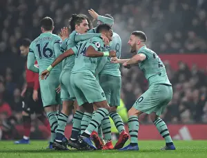 Manchester United V Arsenal 2018-19 Prints: Mustafi, Aubameyang, and Bellerin Celebrate Arsenal's Goal Against Manchester United (2018-19)
