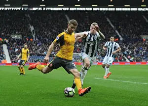 West Bromwich Albion V Arsenal 2016-17 Prints: Mustafi Faces Off Against McClean: Intense Moment from West Bromwich Albion vs