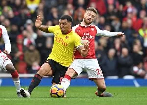 Images Dated 11th March 2018: Mustafi vs. Deeney: Intense Clash Between Arsenal and Watford Players