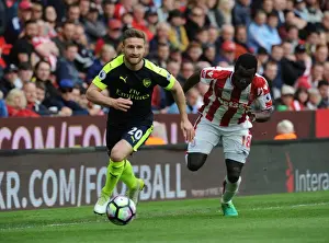 Stoke City V Arsenal 2016-17 Prints: Mustafi vs. Diouf: Intense Clash Between Stoke and Arsenal in Premier League