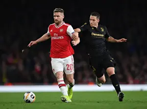 Arsenal V Vitoria Club 2019-20 Prints: Mustafi vs Duarte: A Battle in Arsenal's Europa League Clash Against Vitoria Guimaraes
