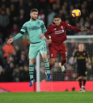 Images Dated 29th December 2018: Mustafi vs. Firmino: Heading Clash in the Premier League Battle between Liverpool and Arsenal