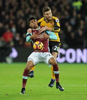Images Dated 3rd December 2016: Mustafi vs Fletcher: Intense Clash in West Ham United vs Arsenal Premier League Match
