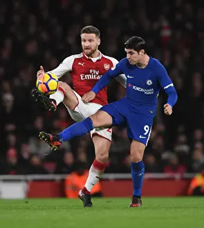 Arsenal V Chelsea 2017-18 Prints: Mustafi vs Morata: A Football Rivalry Unfolds in the Arsenal vs Chelsea Clash