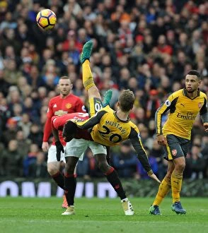 Images Dated 19th November 2016: Mustafi vs. Pogba: Clash at Old Trafford - Manchester United vs. Arsenal, Premier League 2016-17